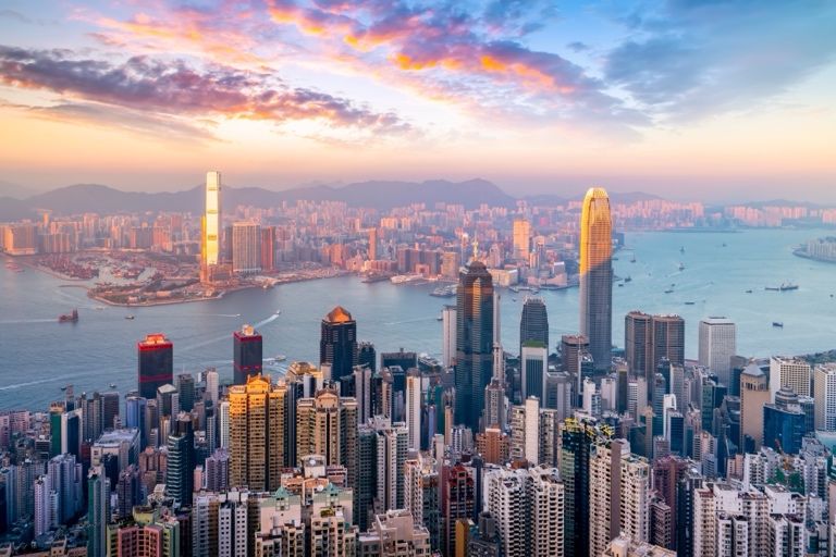 Hong Kong's skyline and Victoria Harbour viewed from Victoria Peak at sunset