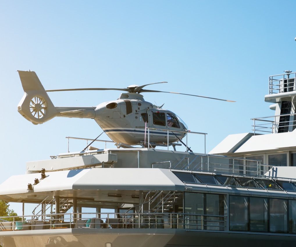 Helicopter on the deck of a luxury yacht