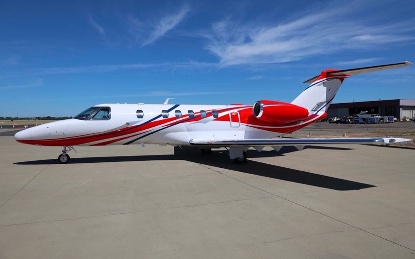 Cessna Citation CJ4 Gen2 private jet in red and white livery parked on the apron